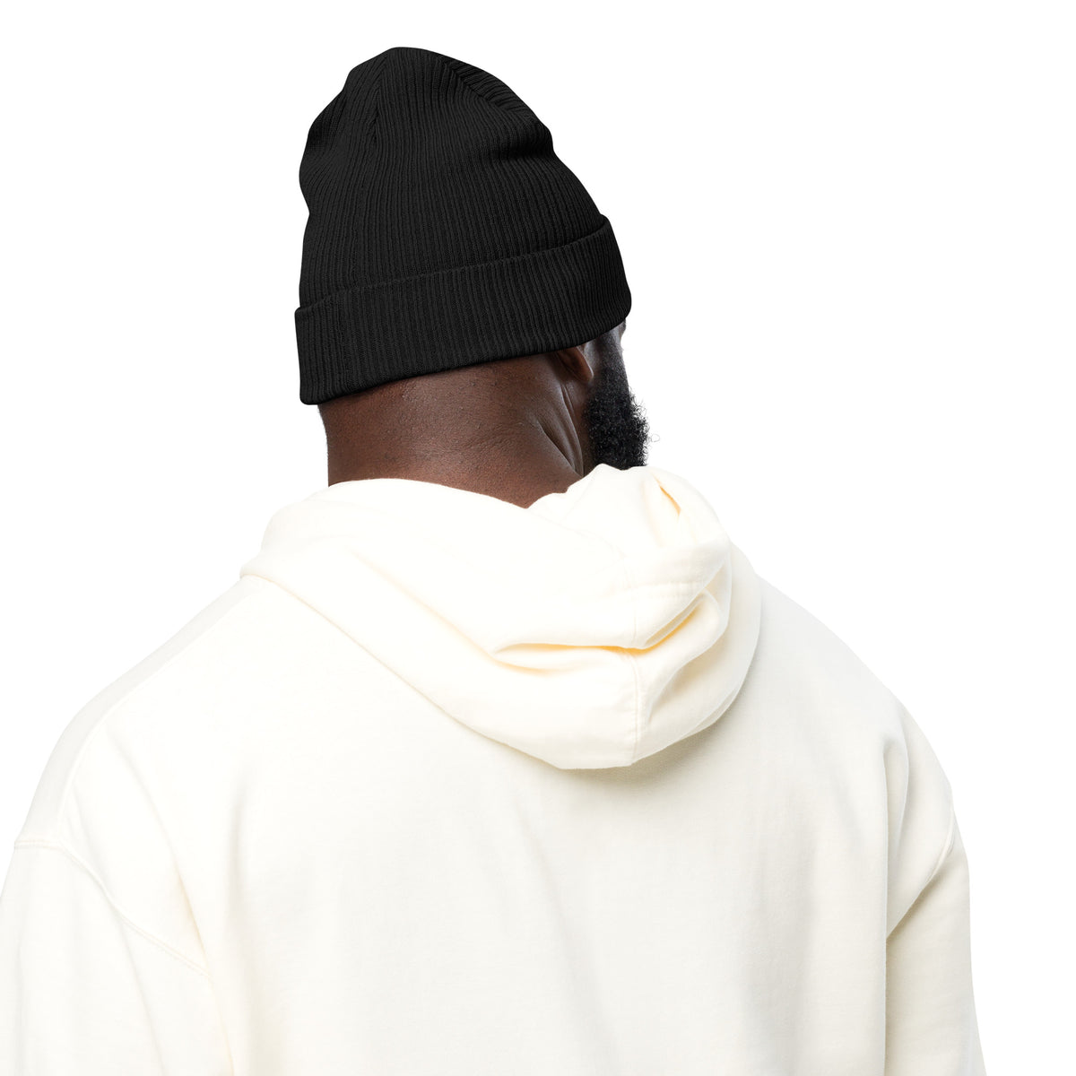 Person wearing a black beanie and white hoodie on a white background