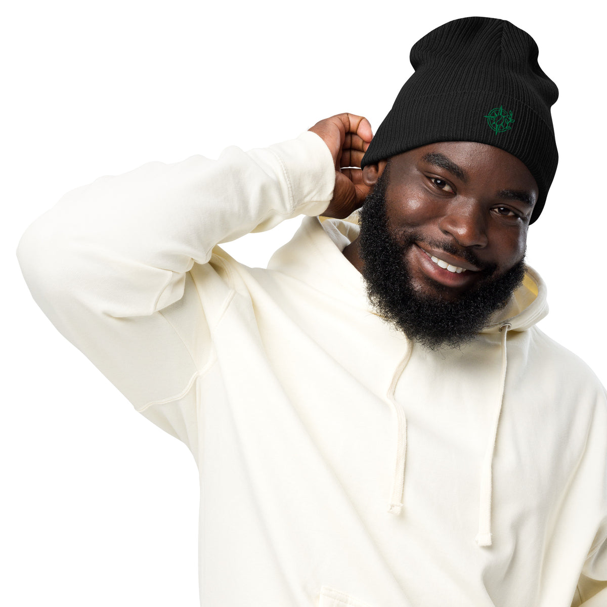 Man wearing a black beanie and white hoodie on a white background