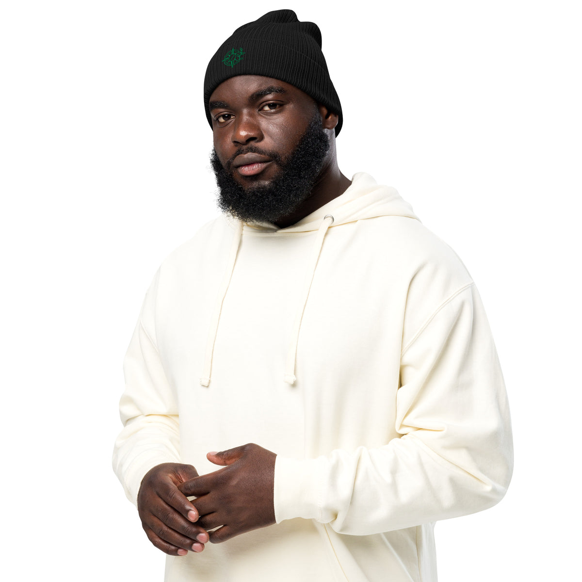 Man wearing a white hoodie and black beanie on a white background