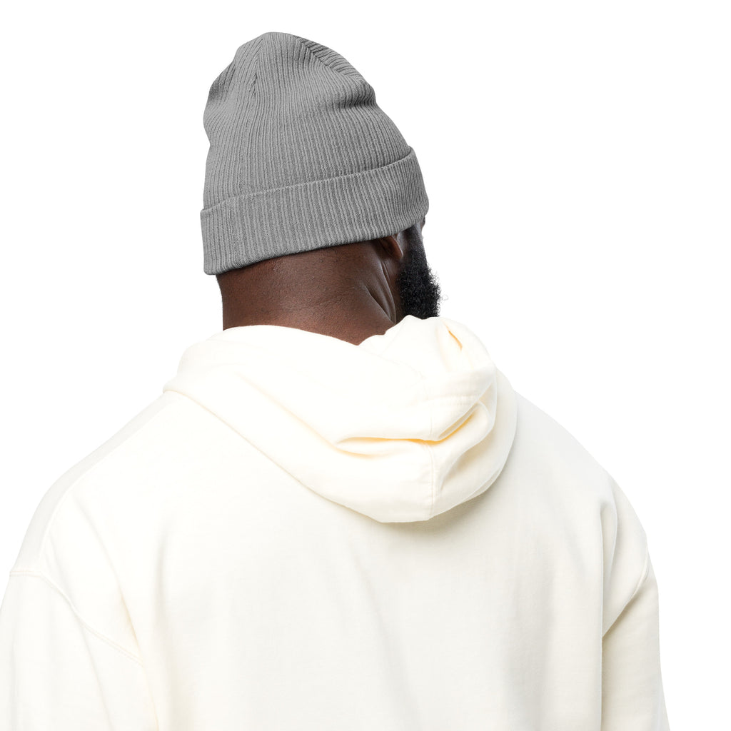 Person wearing a gray beanie and white hoodie on a white background