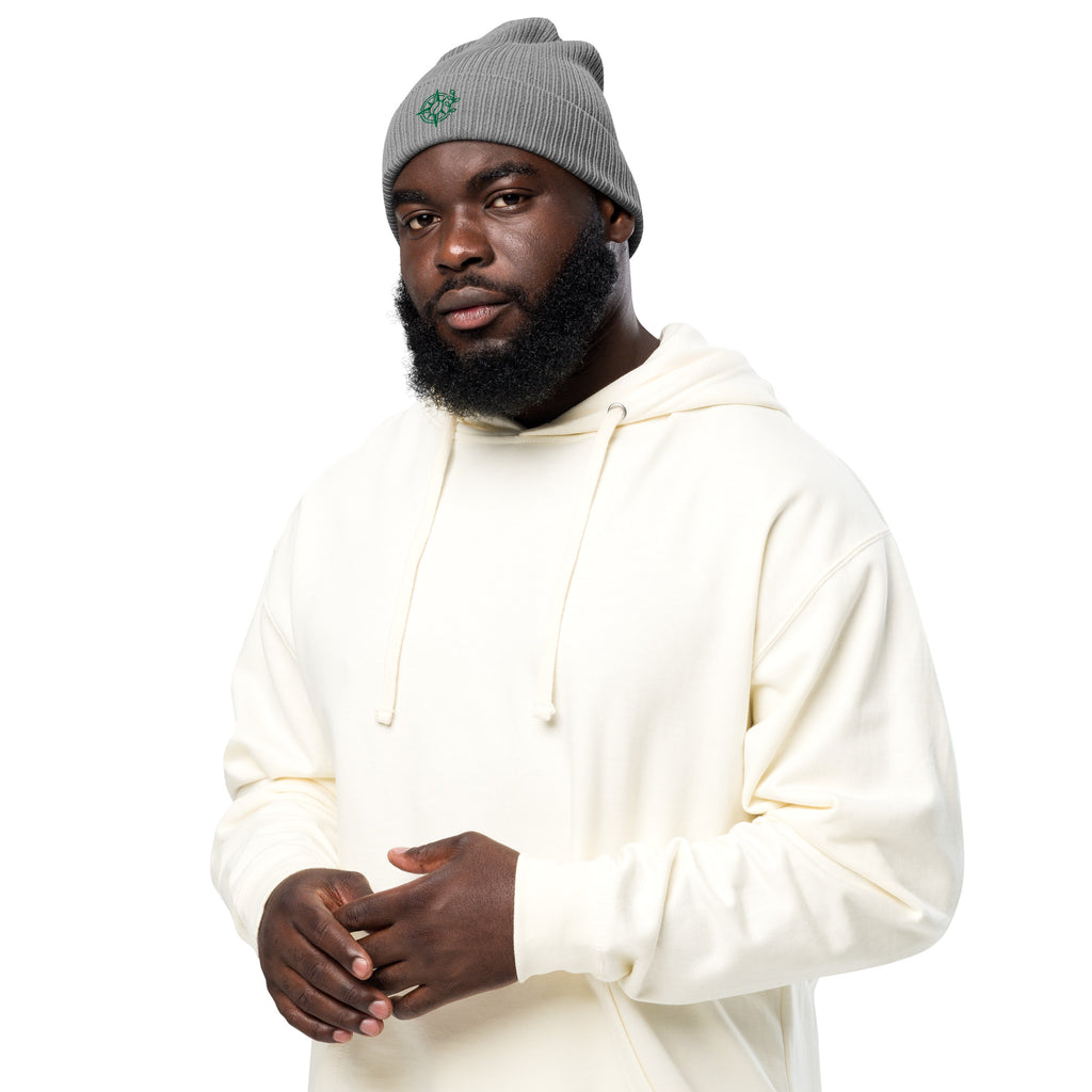 Man wearing a white hoodie and gray beanie on a white background