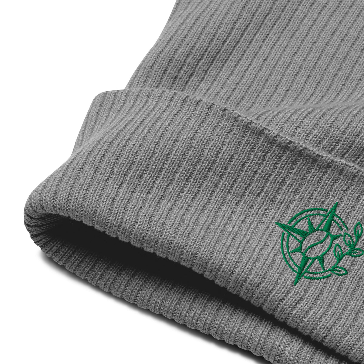 Close-up of a gray ribbed knit beanie with a small green turtle logo on the cuff, shown on a white background.