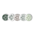 Five round button badges with the 'Coffee Sans Frontière' logo in various color combinations (dark green, white, brown, light blue, and light green) arranged in a row on a white background.
