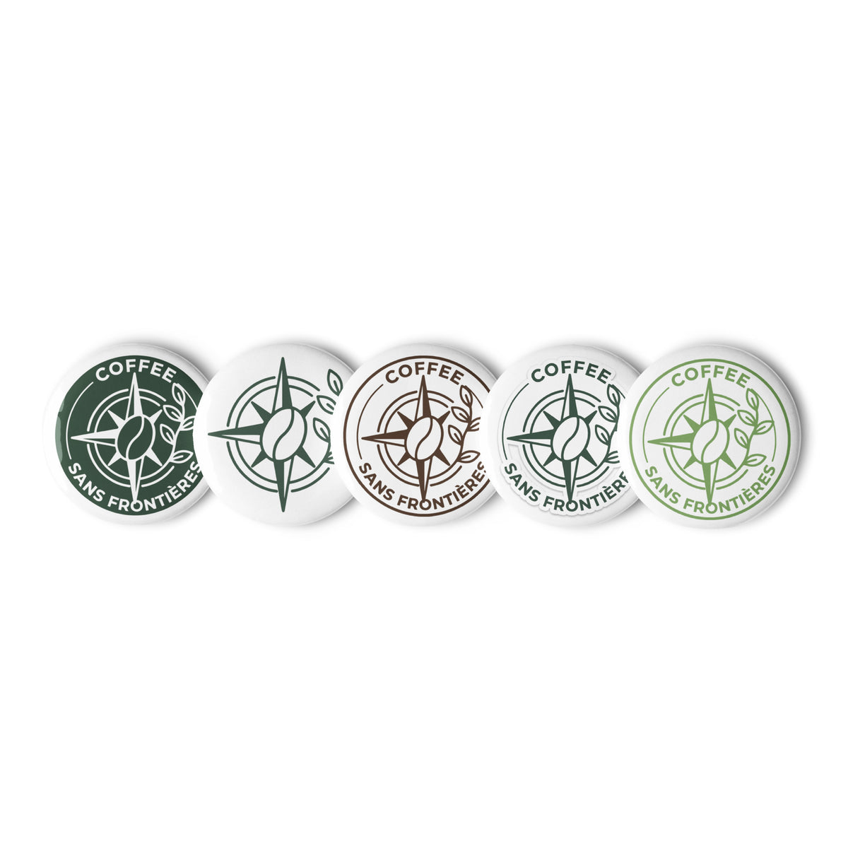 Five round button badges with the 'Coffee Sans Frontière' logo in various color combinations (dark green, white, brown, light blue, and light green) arranged in a row on a white background.