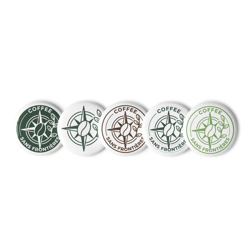 Five round button badges with the 'Coffee Sans Frontière' logo in various color combinations (dark green, white, brown, light blue, and light green) arranged in a row on a white background.