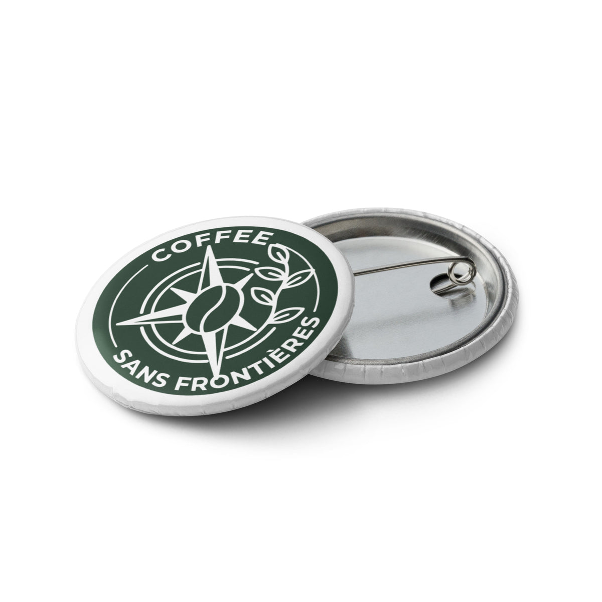 Two round pinback buttons on a white background, one showing the front with a dark green and white coffee bean logo and the text 'COFFEE SANS FRONTIÈRES' and the other showing the silver metal back.
