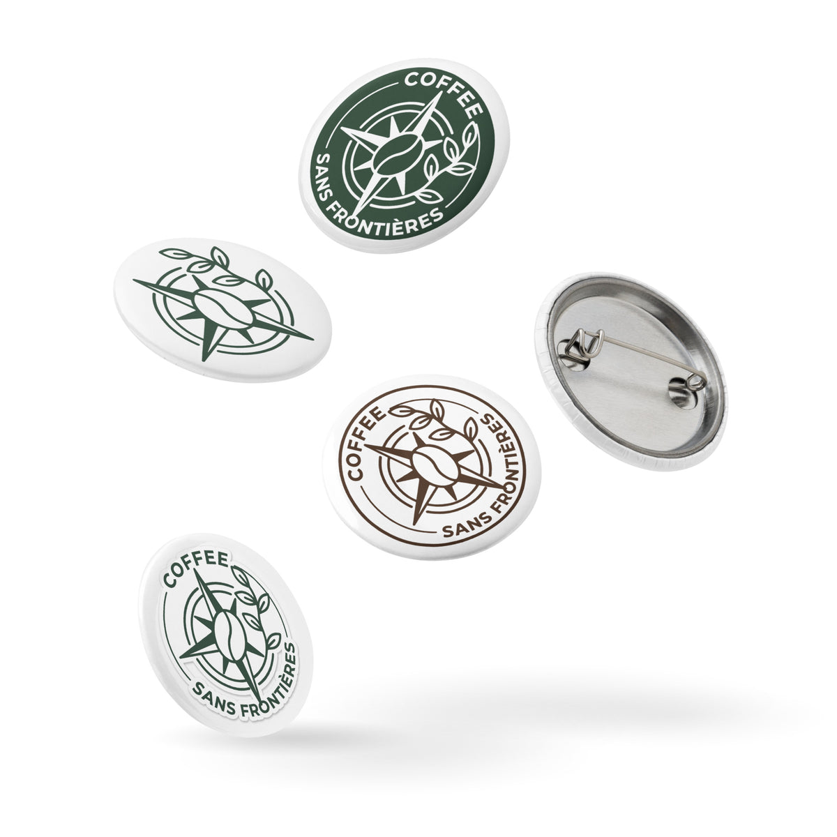 Five oval pinback buttons with the Coffee Sans Frontières logo, shown in green, brown, and silver metal finishes on a white background.
