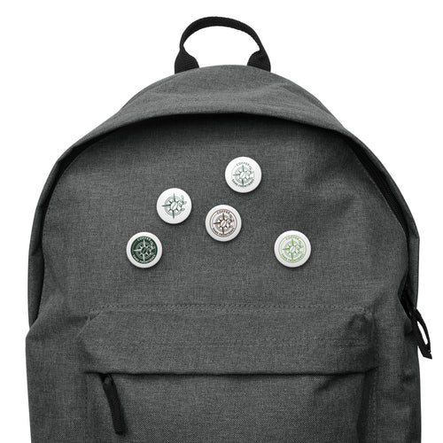 Gray backpack with various pins on a white background